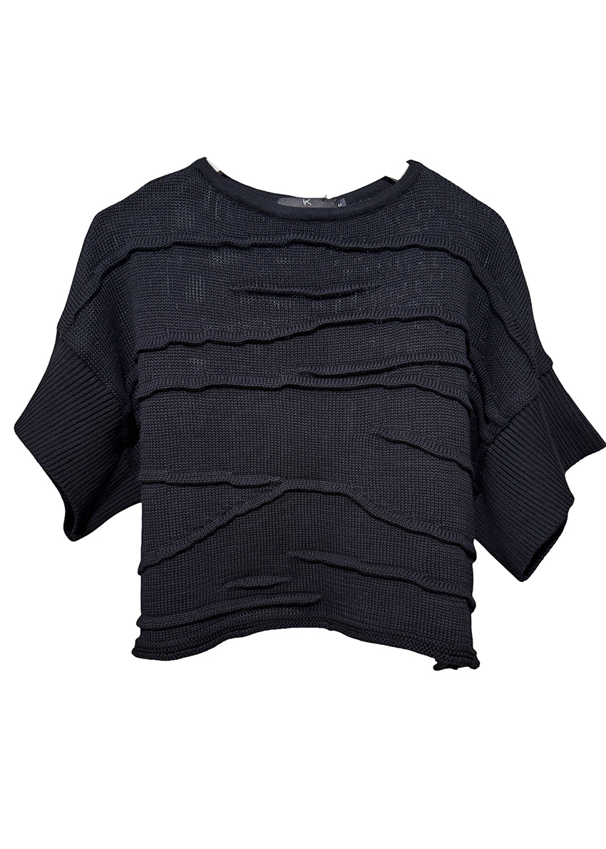 Black layered knit poncho on a white background