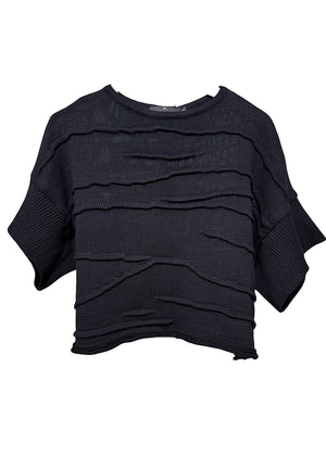 Black layered knit poncho on a white background