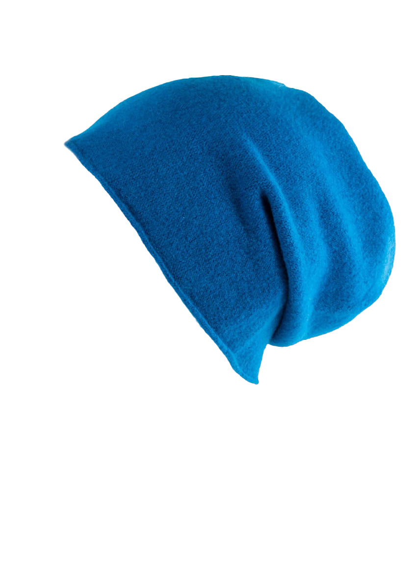 A azure wool beanie on a white background 
