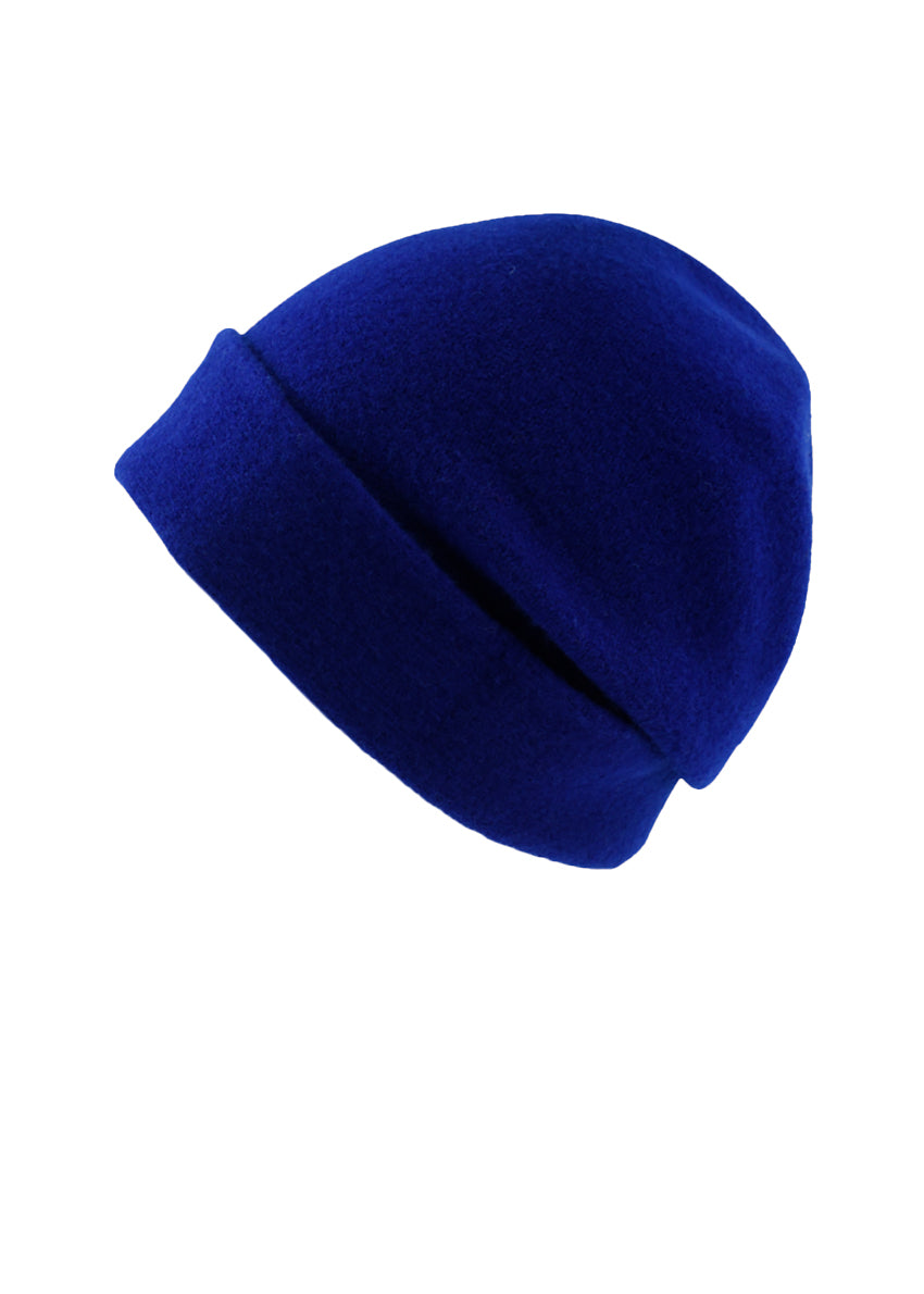 A electric blue wool beanie on a white background 