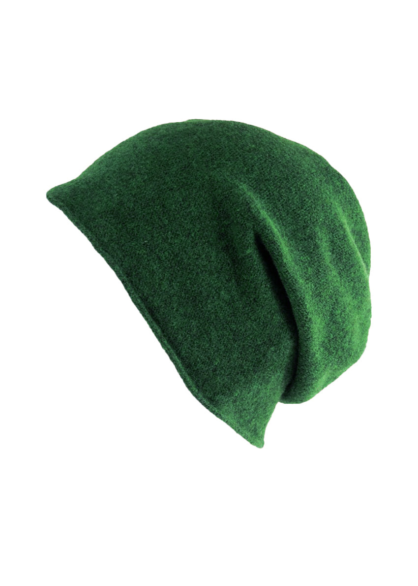 A green wool beanie on a white background 