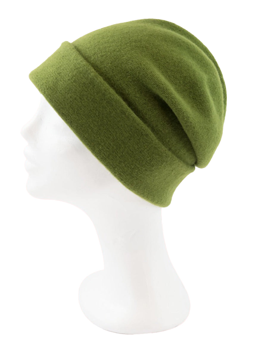 A green yellow wool beanie on a white background 