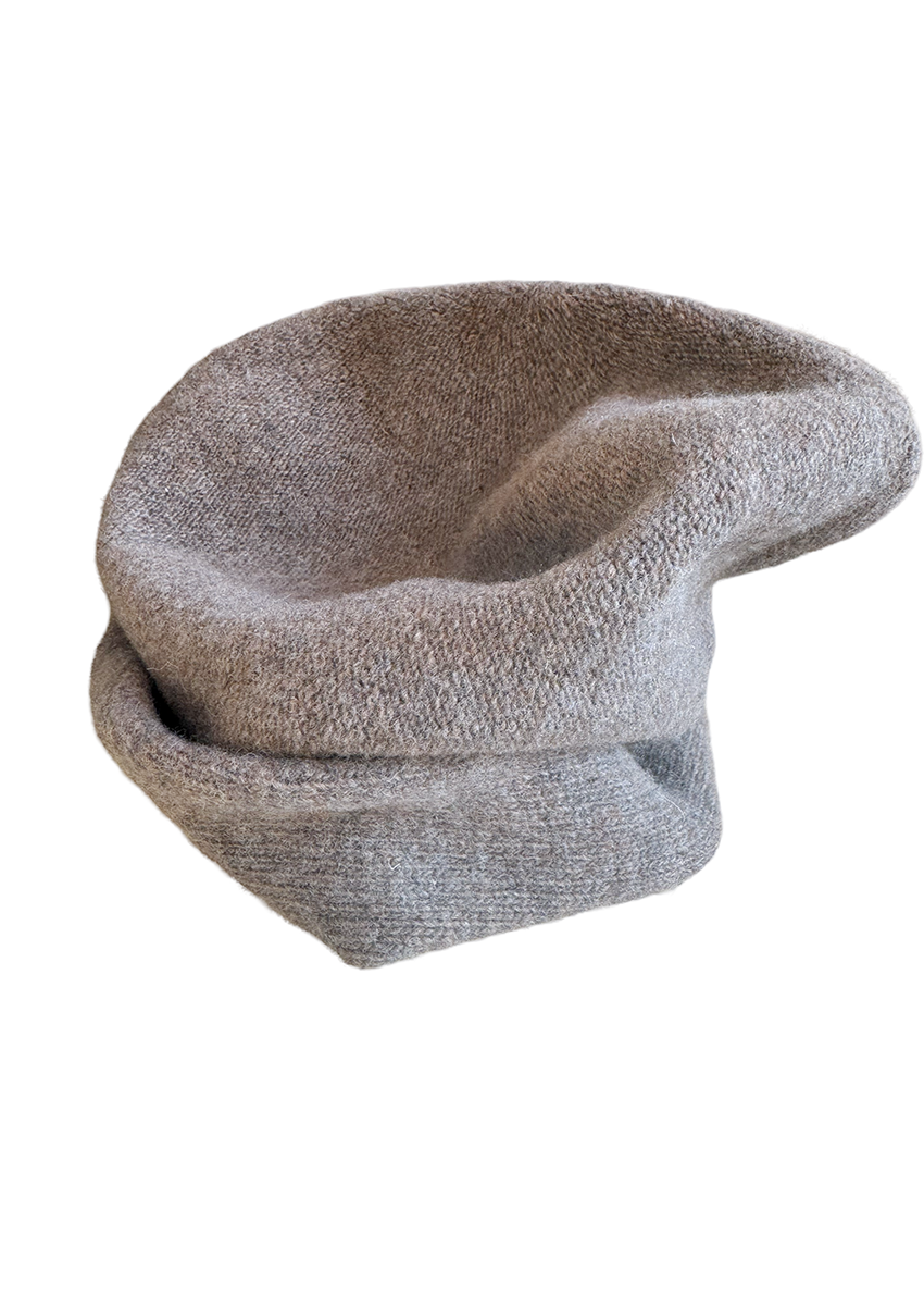 A grey wool beanie on a white background 