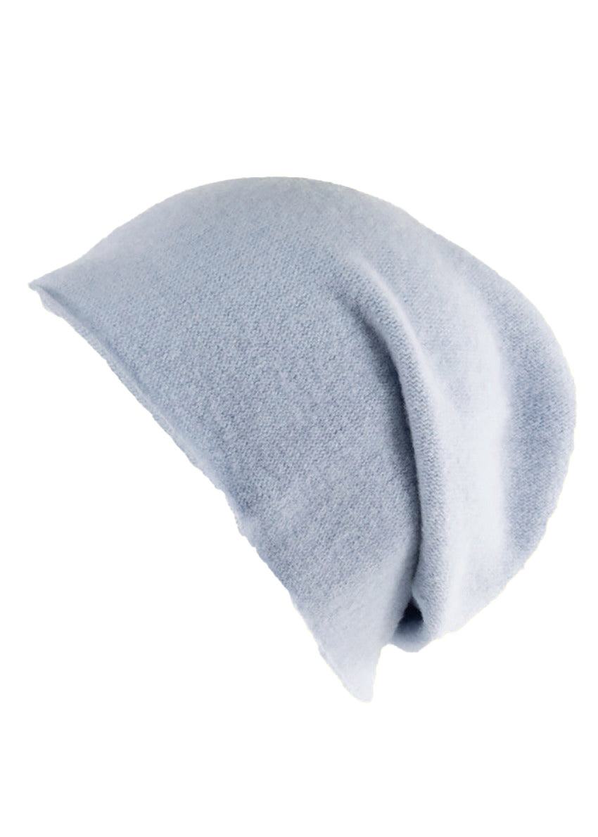 A light blue wool beanie on a white background 