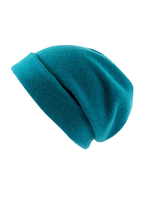 A teal wool beanie on a white background 
