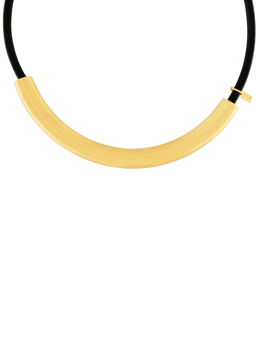 Introducing the Nostalgia Necklace, a statement piece that will elevate any outfit. The gold plating adds a touch of luxury, while the scratched surface adds a unique texture. Crafted with a brass foundation and carefully plated in either silver or 14 Carat Gold