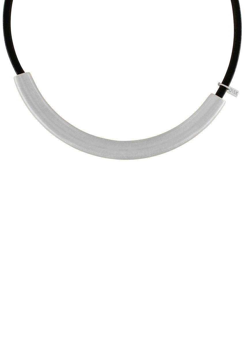 Introducing the Nostalgia Necklace, a statement piece that will elevate any outfit. The silver plating adds a touch of luxury, while the scratched surface adds a unique texture. Crafted with a brass foundation and carefully plated in either silver or 14 Carat Gold