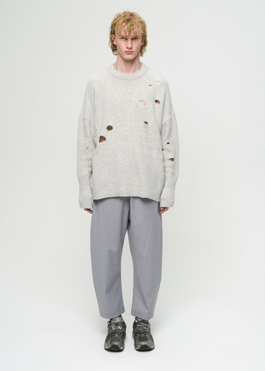 Unisex, mid-length grey trousers, made from soft, non-stretch rayon fabric, in a relaxed, organic cut, featuring a wide elastic waistband, a dropped crotch, and front pockets