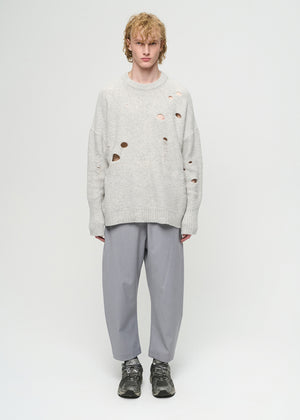 Unisex, mid-length grey trousers, made from soft, non-stretch rayon fabric, in a relaxed, organic cut, featuring a wide elastic waistband, a dropped crotch, and front pockets