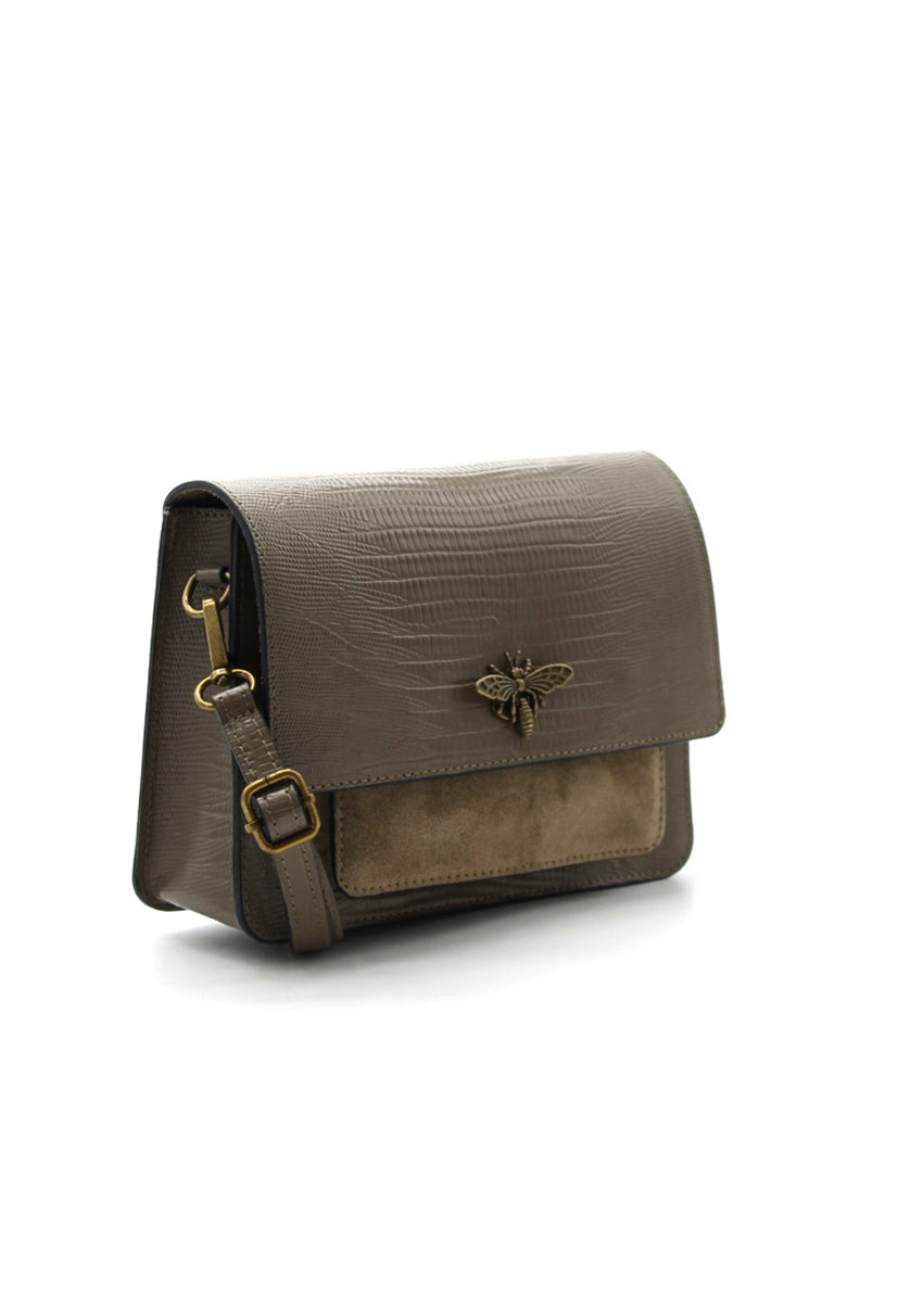 Olive leather handbag with a bee emblem on a white background