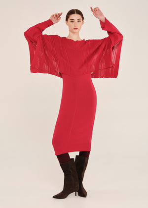 Woman wearing a red dress with a white background