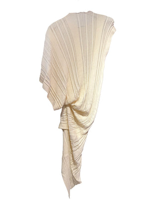 Knitted cornsilk midi dress in an asymmetrical shape with the “Archetypes” rib pattern and yarn made of 100% high quality Greek cotton. It is sleeveless on one side, while short sleeved on the other.