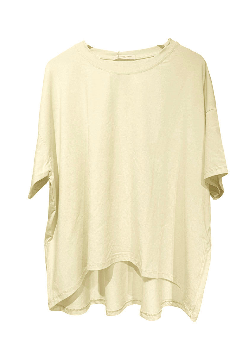 Person wearing a white t-shirt and pink pants on a plain background