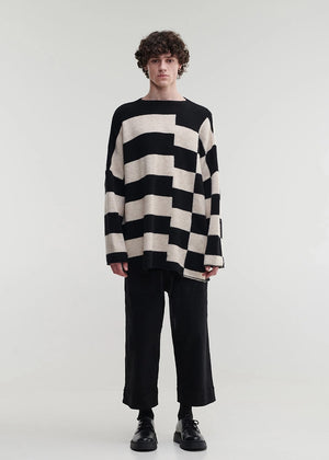 Knitted unisex oversized top in a fluffy yarn blend with a round neckline, designed for a relaxed fit and versatile styling.