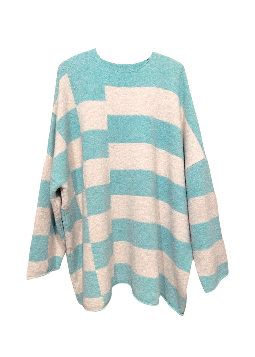 Knitted unisex oversized top in a fluffy yarn blend with a round neckline, designed for a relaxed fit and versatile styling.