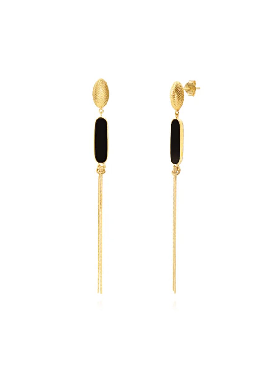 Pair of gold and black earrings on a white background