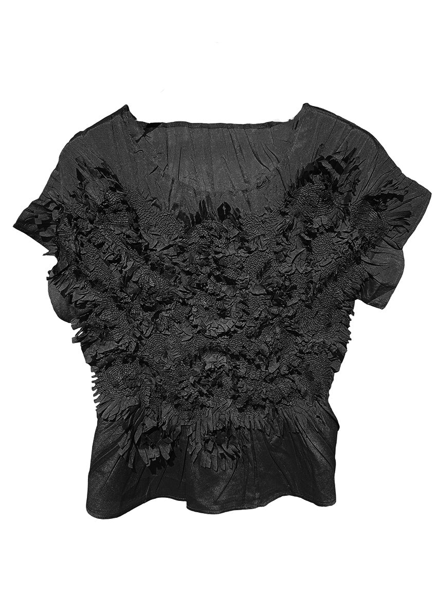 Black top with textured floral design, elasticated waist, and short sleeves.
