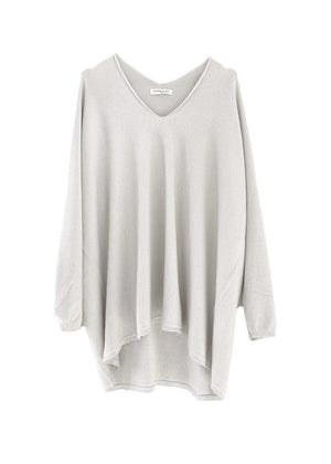 A ivory sweater on a white background 