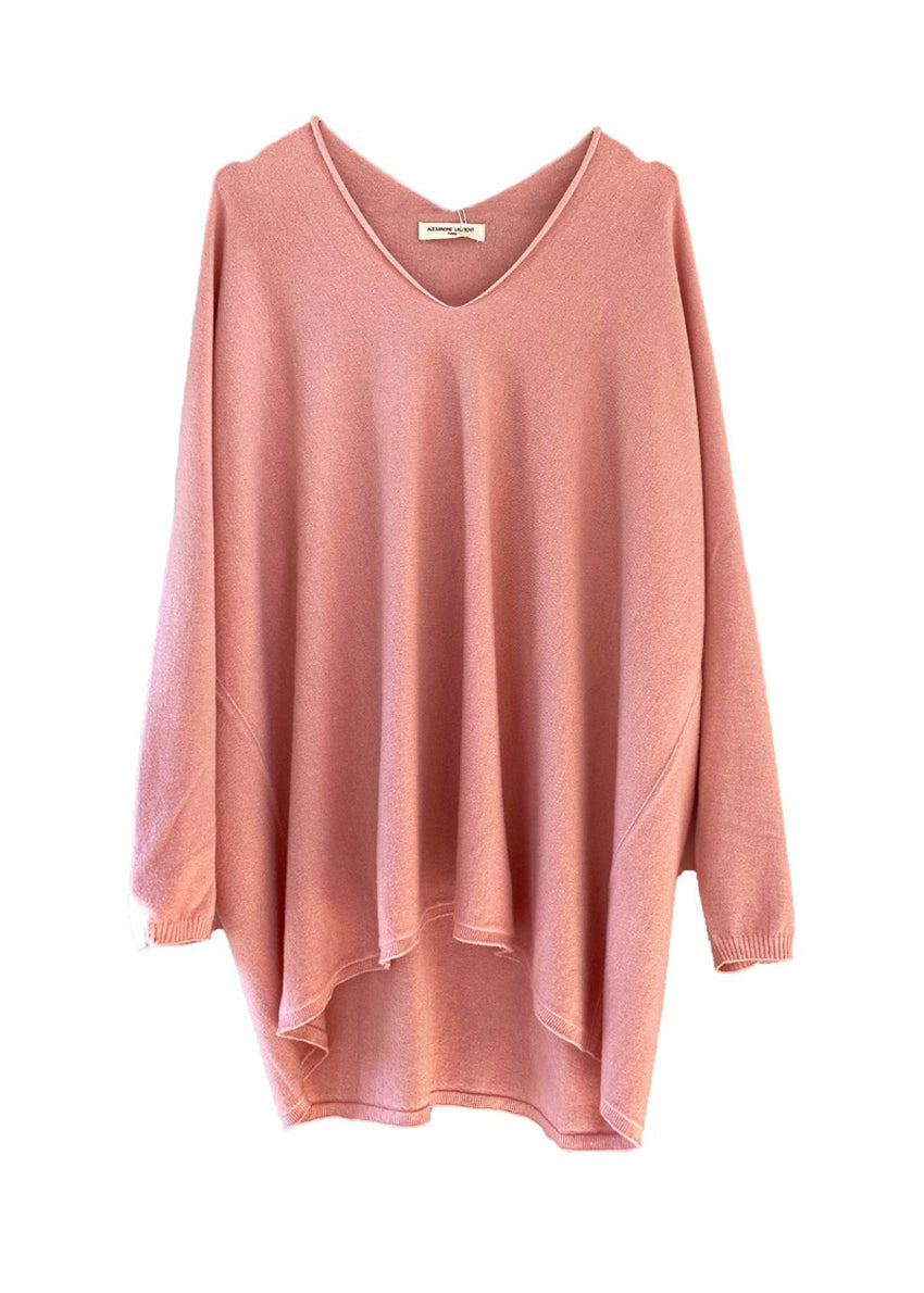 Pink sweater on a white background