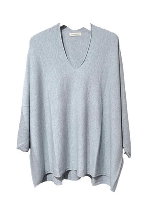 A light steel blue sweater on a white background 