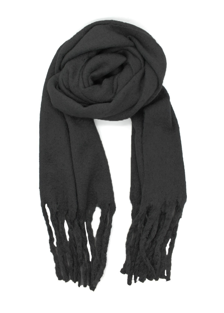 Envelop yourself in a cocoon of comfort with this exquisite scarf. Its luxuriously soft texture provides a comforting touch. Enhancing the design, the scarf features medium-sized fringes create a subtle movement