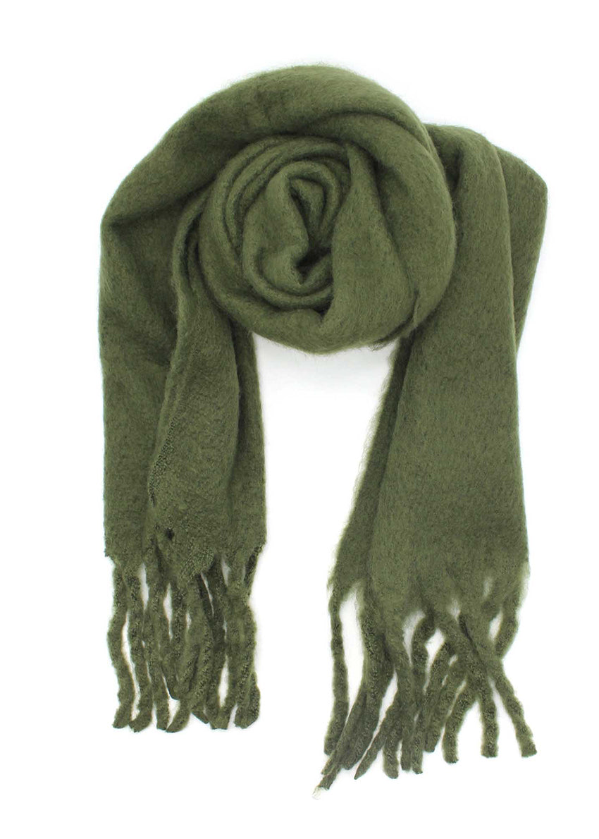 Envelop yourself in a cocoon of comfort with this exquisite dark olive green scarf. Its luxuriously soft texture provides a comforting touch. Enhancing the design, the scarf features medium-sized fringes create a subtle movement
