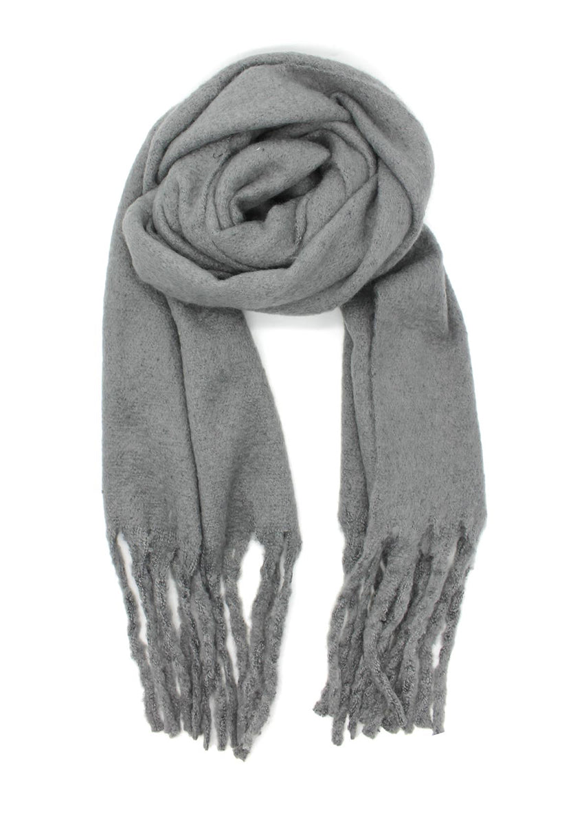Envelop yourself in a cocoon of comfort with this exquisite grey scarf. Its luxuriously soft texture provides a comforting touch. Enhancing the design, the scarf features medium-sized fringes create a subtle movement