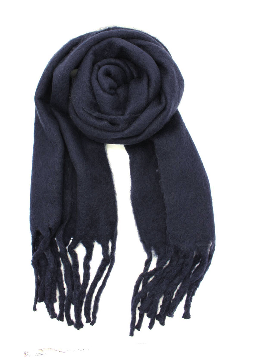 Envelop yourself in a cocoon of comfort with this exquisite midnight blue scarf. Its luxuriously soft texture provides a comforting touch. Enhancing the design, the scarf features medium-sized fringes create a subtle movement