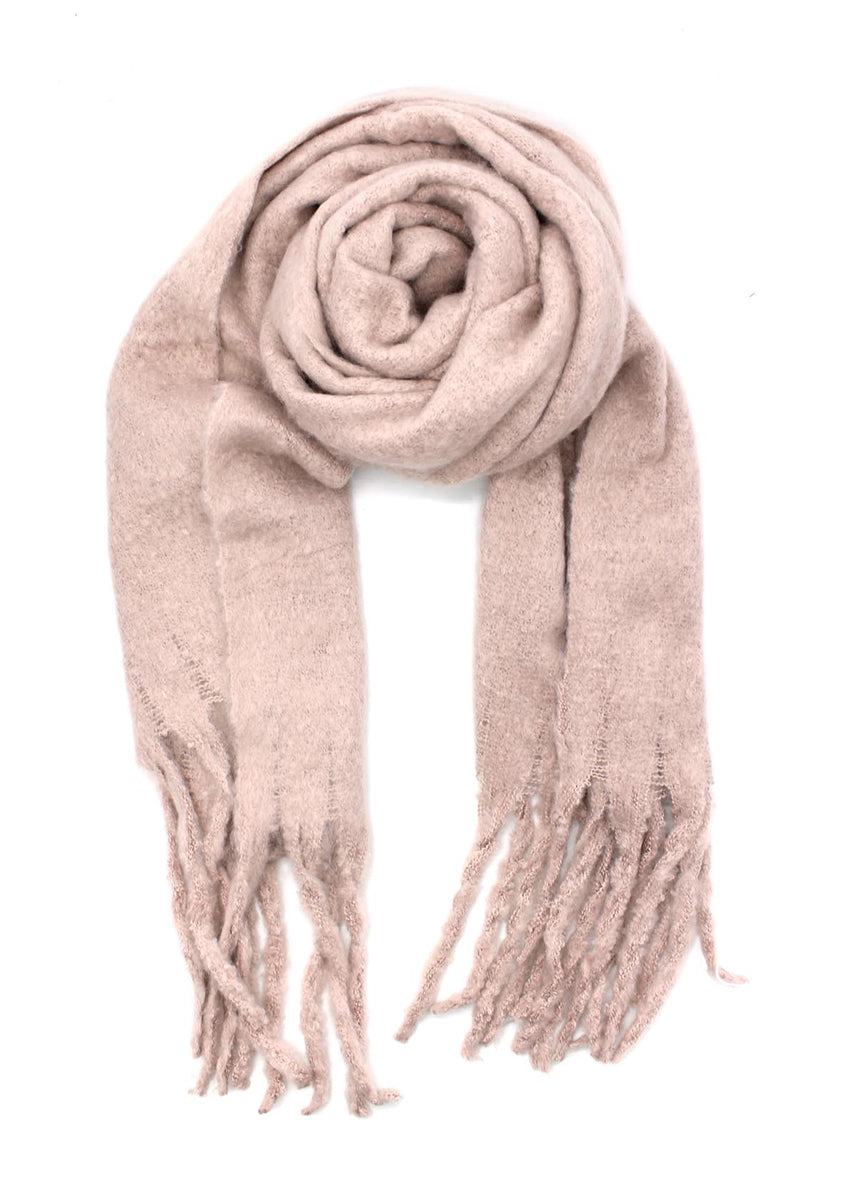 Envelop yourself in a cocoon of comfort with this exquisite pink scarf. Its luxuriously soft texture provides a comforting touch. Enhancing the design, the scarf features medium-sized fringes create a subtle movement