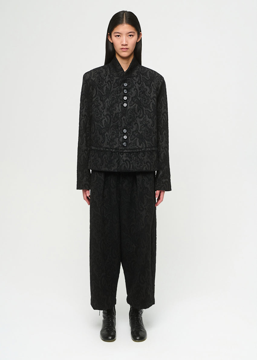 Black patterned pants on a white background