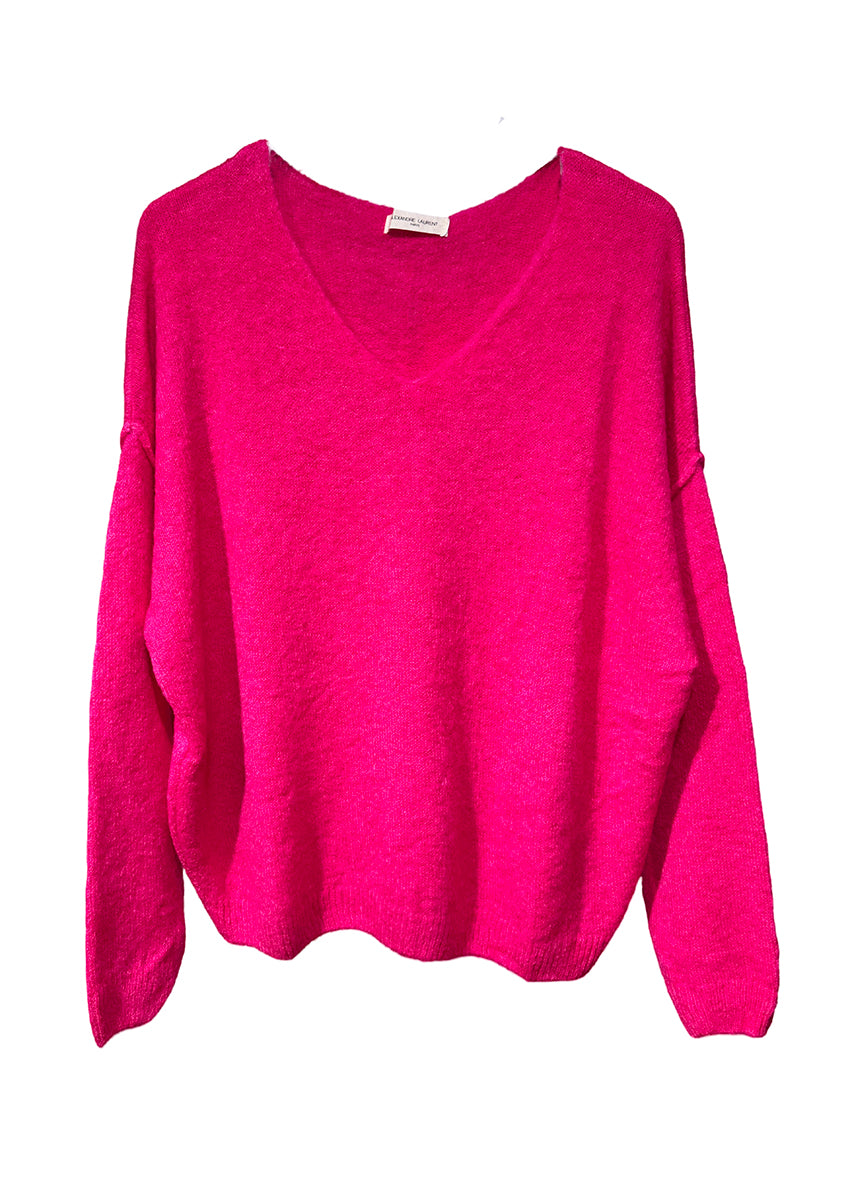 A deep pink, loose-fitting, long-sleeved sweater with a deep V neckline.