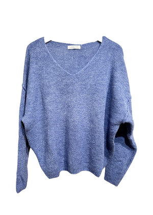 A steel blue, loose-fitting, long-sleeved sweater with a deep V neckline.