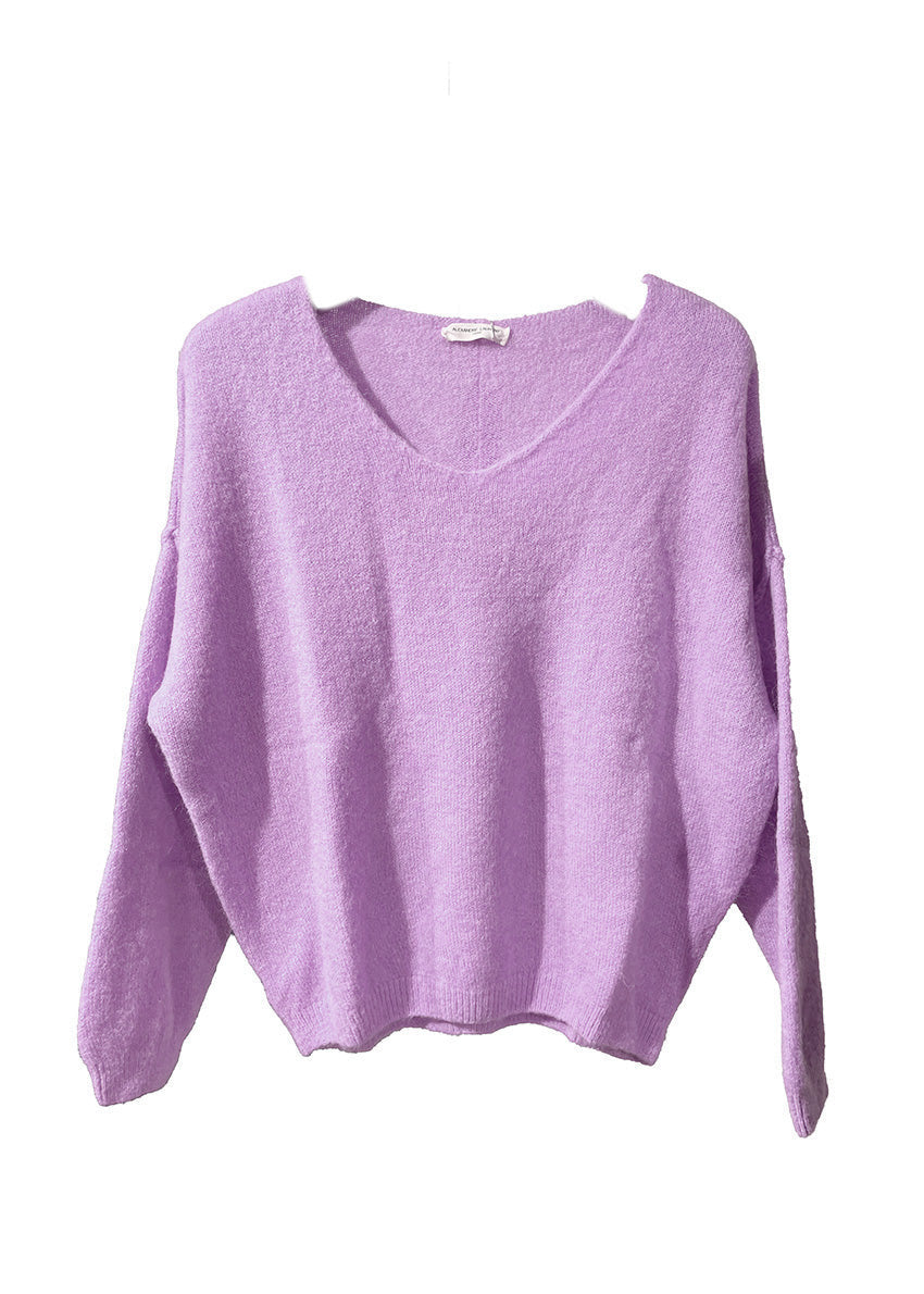A thistle, loose-fitting, long-sleeved sweater with a deep V neckline.