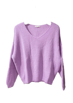 A thistle, loose-fitting, long-sleeved sweater with a deep V neckline.