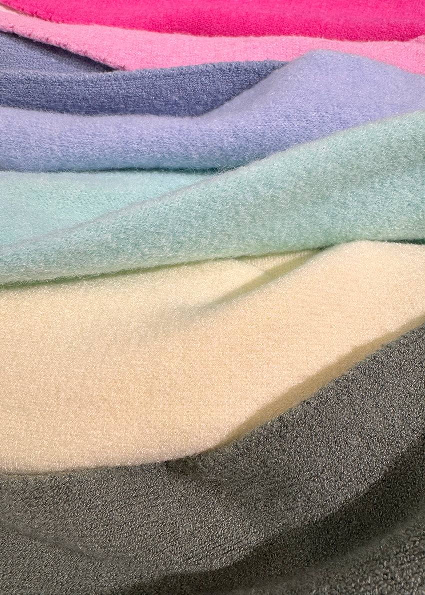 Stack of multicolored fabric swatches