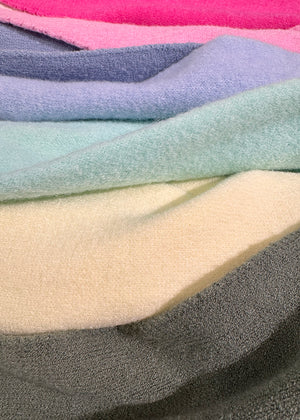 Stack of multicolored fabric swatches