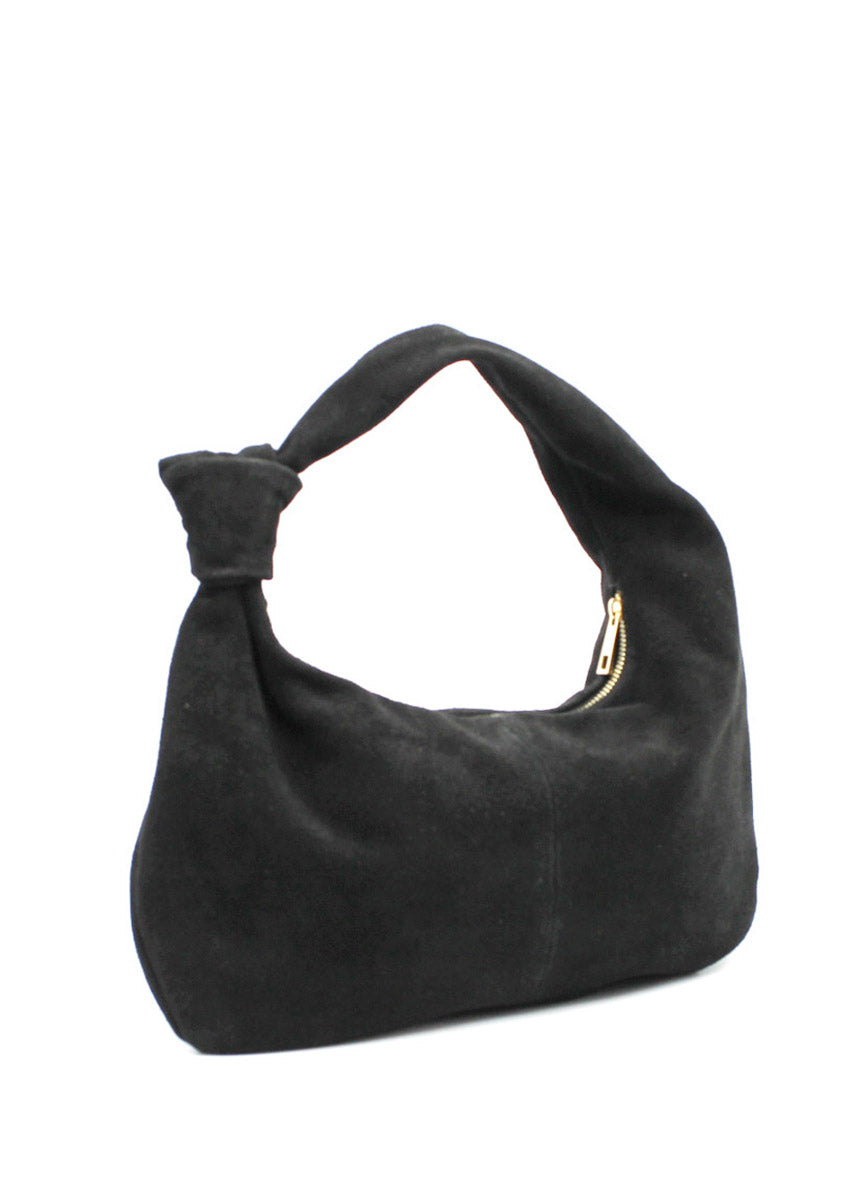 This is a stylish and contemporary hobo bag crafted from soft suede leather . Its slouchy, relaxed silhouette makes it an effortless choice for casual outings, while the luxurious suede adds a touch of sophistication. The bag features a single, wide handle with a chic knot detail, allowing it to sit comfortably on your shoulder.