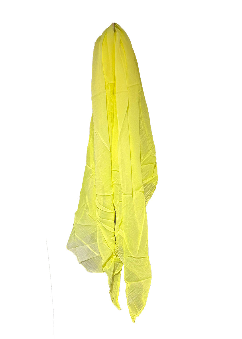 Yellow scarf draped over a white background