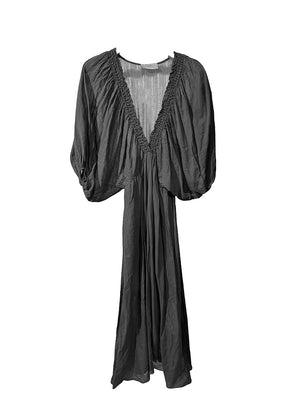 Black dress with sheer neckline on a white background