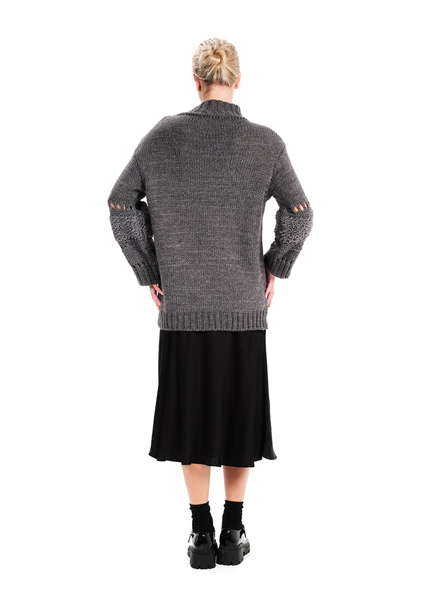 Knit long – sleeved grey top in a loose fit.Knit long – sleeved top in a loose fit made of a blend of two different fabrics.Pair it with pieces from our collection for the ultimate winter outfits.