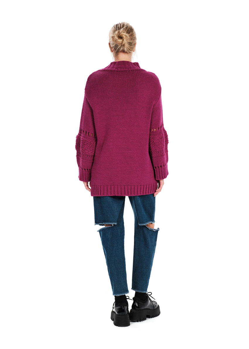 Knit long – sleeved magenta top in a loose fit.Knit long – sleeved top in a loose fit made of a blend of two different fabrics.Pair it with pieces from our collection for the ultimate winter outfits.