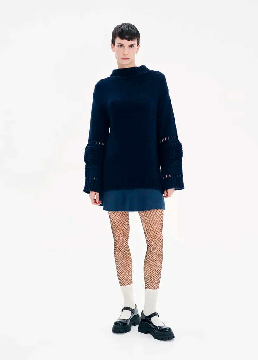 Knit long – sleeved blue top in a loose fit.Knit long – sleeved top in a loose fit made of a blend of two different fabrics.Pair it with pieces from our collection for the ultimate winter outfits.