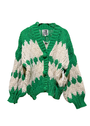 Green and white knitted cardigan on a white background