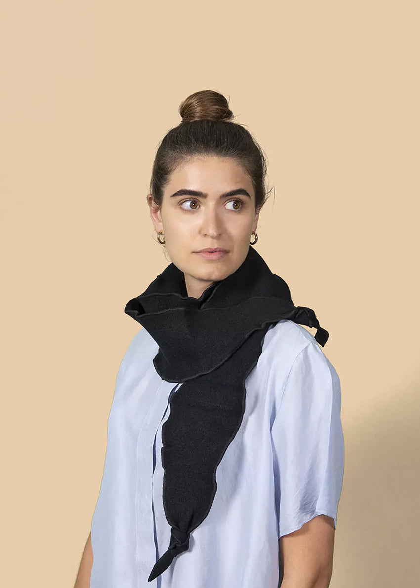 Experience the graceful undulation of our undulated scarves, meticulously crafted from 100% Pure Merino Wool.