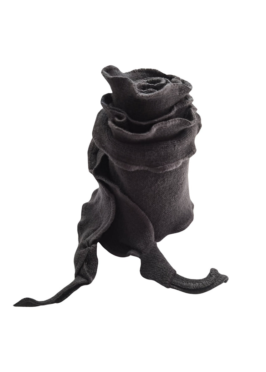 Experience the graceful undulation of our undulated scarves, meticulously crafted from 100% Pure Merino Wool.