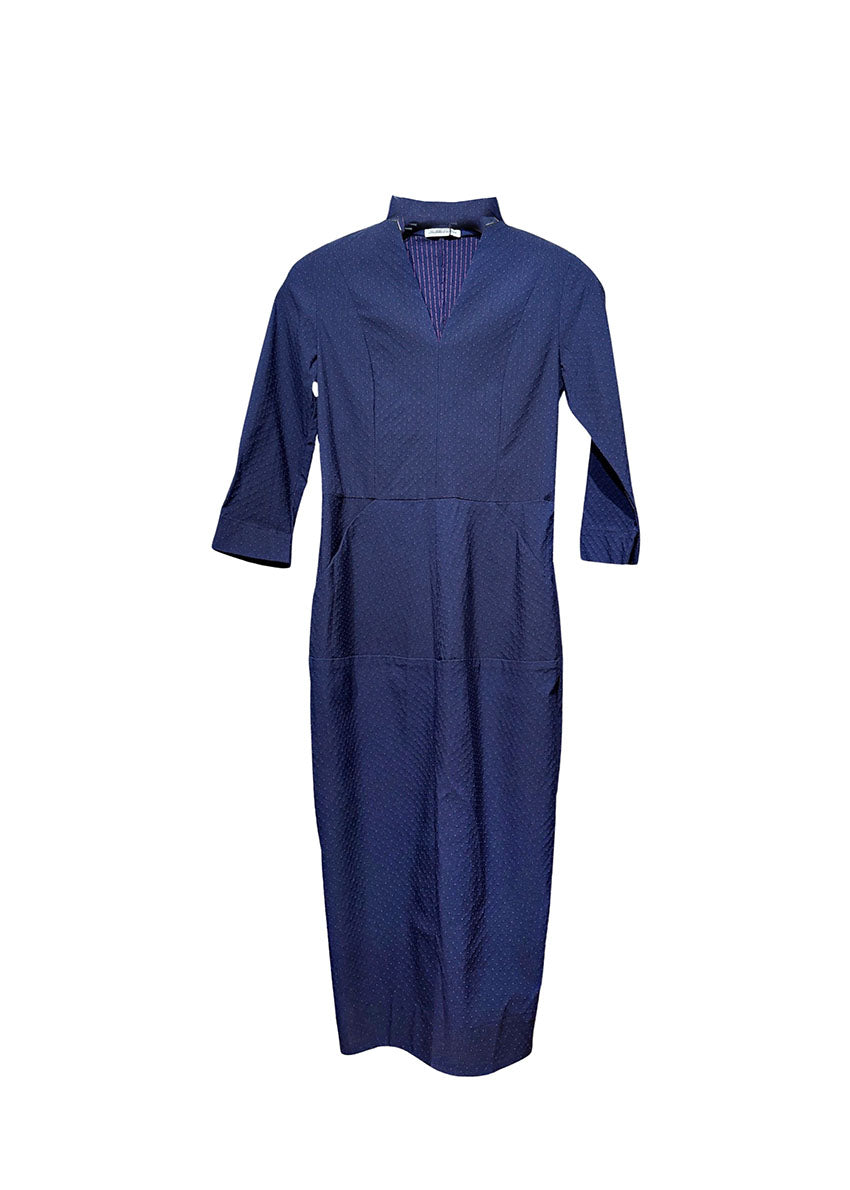 A dark blue cotton dress with textured small dots and stripes, featuring a V neckline, 3/4 sleeves with slits for adjustment, and pockets.