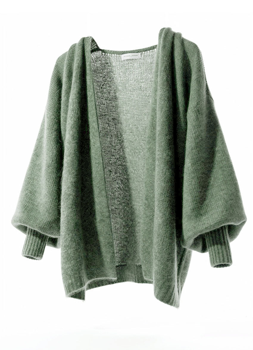 Green sweater on a white background