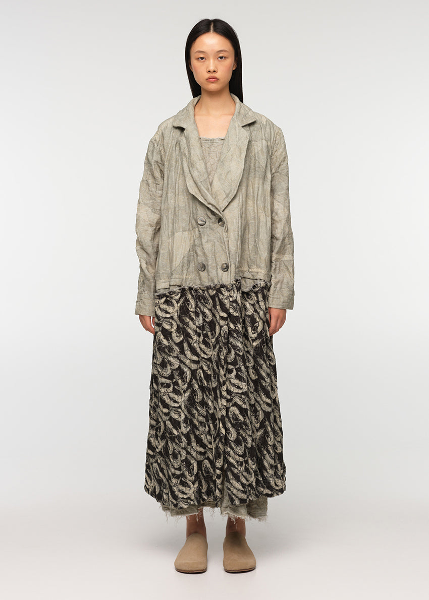 Long oversized crossover coat with a deep V collar, made from a combination of two different prints, crafted from crinkled soft cotton/linen fabric with decorative frayed edges at the seams. SARDINES features two front pockets.