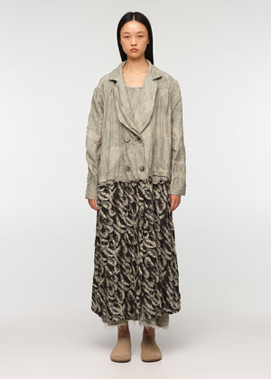 Long oversized crossover coat with a deep V collar, made from a combination of two different prints, crafted from crinkled soft cotton/linen fabric with decorative frayed edges at the seams. SARDINES features two front pockets.
