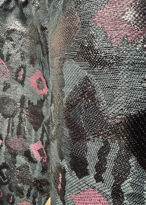 A pair of sequin painted pants with a floral pattern in a mix of colors, predominantly in shades of purple and metallic sequins.